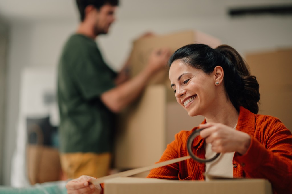 Canadian packing up moving boxes.